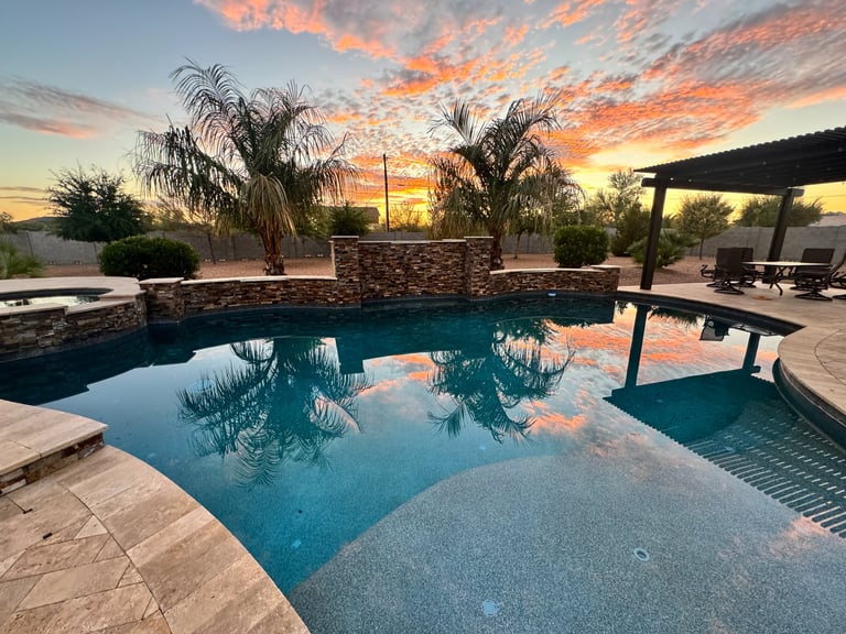 Desert sunset with pool